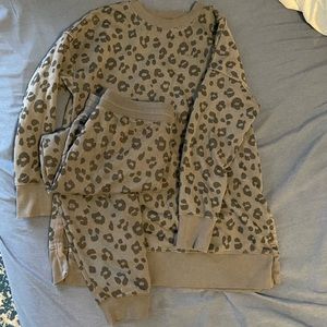 Grey and black cheetah sweat suit.